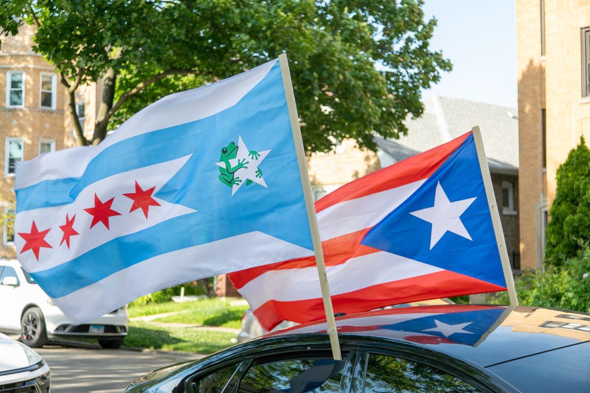 Puerto Rican and Chicago Puerto Rican flags fly above a business in Chicago’s West Ridge neighborhood on Thursday, June 4, 2026. The display reflects the cultural diversity of the area, which is home to large Latino, South Asian, Jewish and immigrant communities, and is one of Chicago’s most ethnically diverse neighborhoods. This photo is part of the Columbia Chronicle’s “77 Community Areas” project, documenting Chicago ahead of America’s 250th birthday.