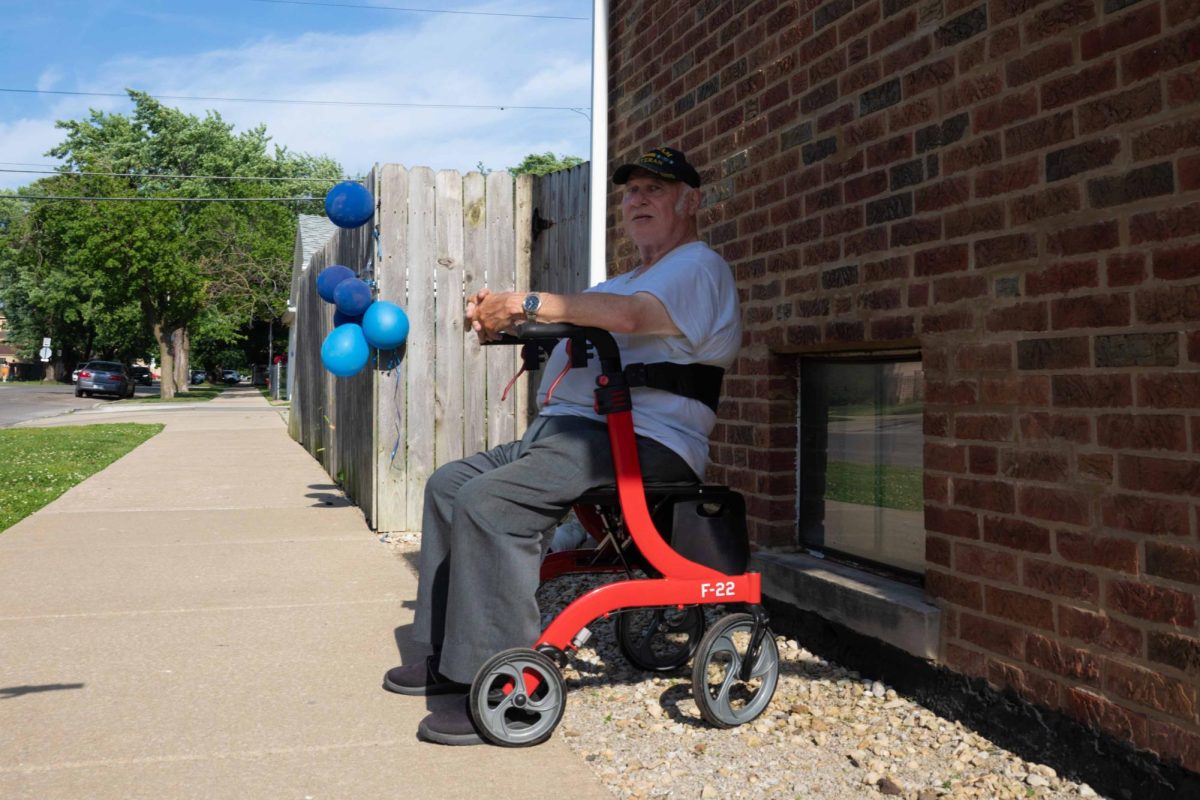 Vietnam War veteran Kenneth Cupski relaxes in the shade as temperatures rise ahead of summer in Chicago’s West Elsdon neighborhood. West Elsdon is a neighborhood on the Southwest Side of Chicago. This photo is part of the Columbia Chronicle’s “77 Community Areas” project, documenting Chicago ahead of America’s 250th birthday.