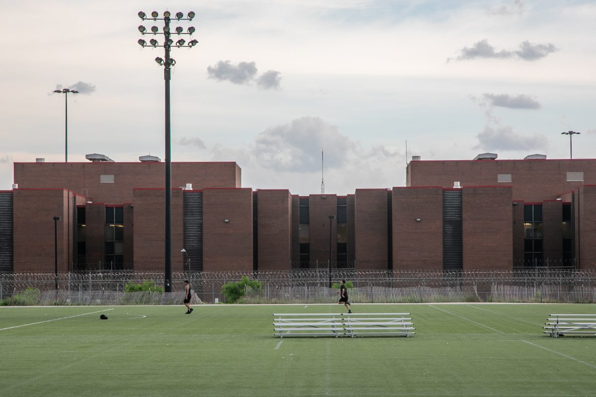 Teenagers play soccer at La Villita Park’s soccer field in South Lawndale, Chicago on Wednesday, June 10, 2026, with the Cook County Department of Corrections as a backdrop. This photo is part of the Columbia Chronicle’s “77 Community Areas” project, documenting Chicago ahead of America’s 250th birthday.