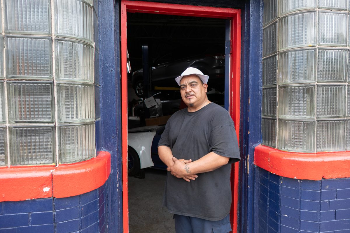 Alfredo Vera, a mechanic at Brakes 4 Less and an Edgewater resident for 25 years, recounts his first day on the job in 1999 on Thursday, June 11, 2026. This photo is part of The Columbia Chronicle’s “77 Community Areas” project documenting Chicago ahead of America’s 250th birthday.