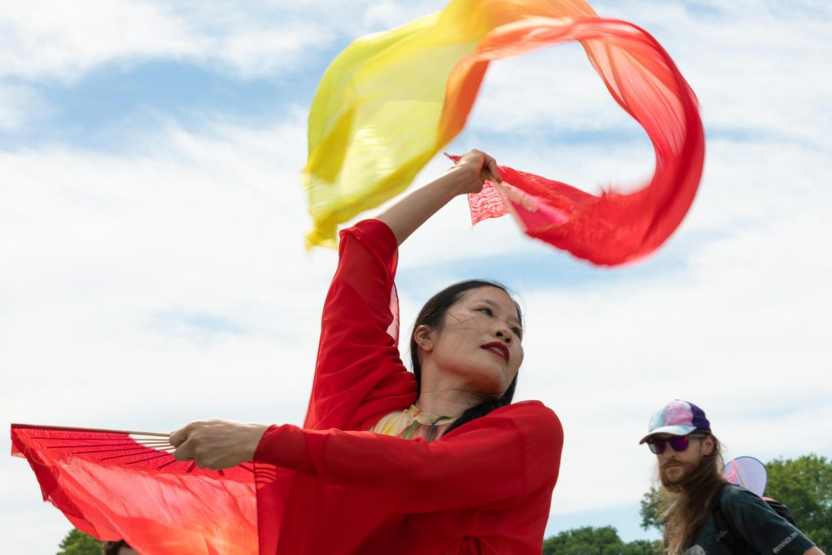 Irene Hsiao performs as the Vermilion Bird of the South on a boardwalk path during a production of her work “Guardians of the Earth and Sky” at Palmisano Park on Saturday, July 11, 2026.