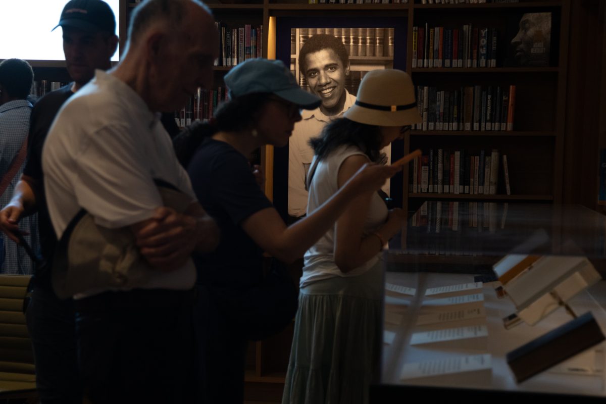 A photo of young, former President Barack Obama shines among the books in the President’s Reading Room at the library attached to the building on Tuesday, June 30, 2026.