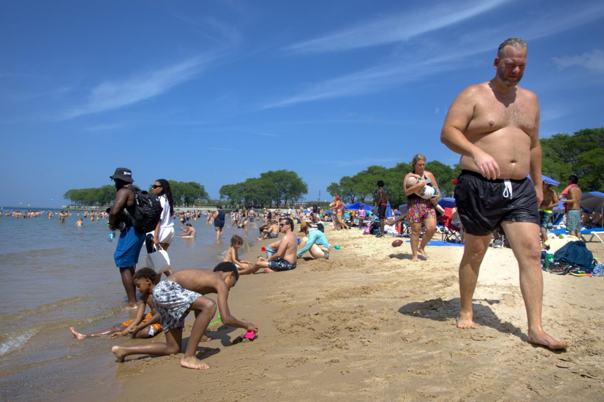 Beachgoers escape Chicago's heatwave by cooling off at Ohio Street Beach in the Streeterville neighborhood on Wednesday, July 1, 2026. This photo is part of the Columbia Chronicle’s “77 Community Areas” project, documenting Chicago ahead of America’s 250th birthday.