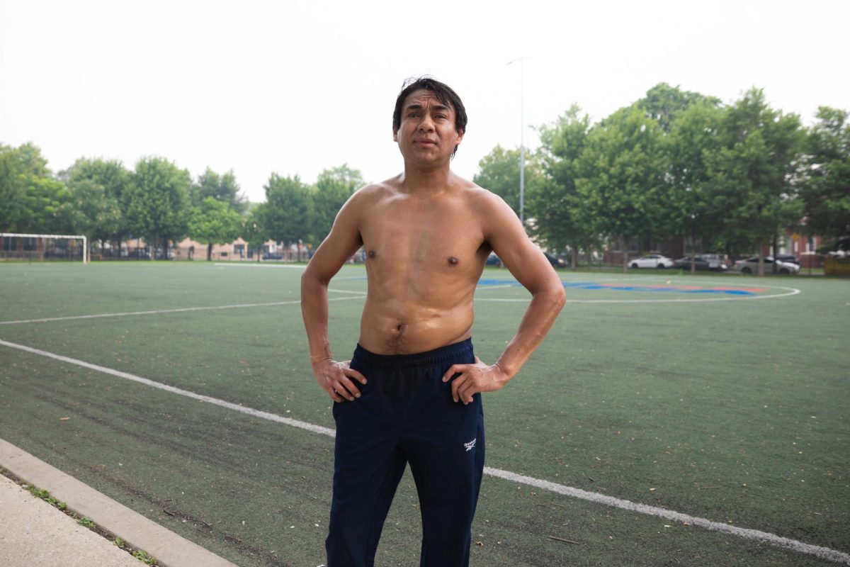 Alejandro Camacho stands hands-on-hips at Cornell (Paul) Square Park in the Back of the Yards neighborhood. Visiting from Mexico to spend time with his partner, he is currently residing in the neighborhood amid a high air quality alert that has blanketed the area on Friday, July 17, 2026. This photo is part of the Columbia Chronicle’s “77 Community Areas” project, documenting Chicago in celebration of America’s 250th birthday.