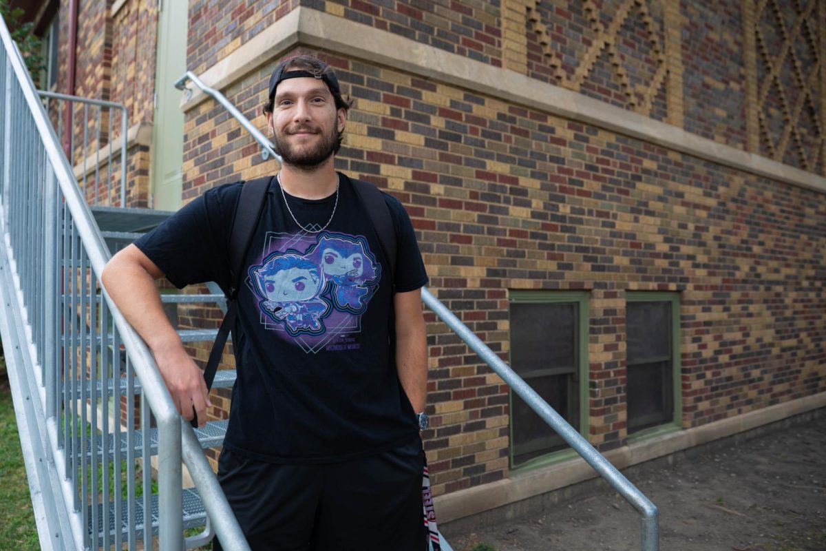 Edgar R. Metaj, athletic assistant at the Neighborhood Boys & Girls Club in the North Center neighborhood, poses for a portrait outside the building on Friday, July 31, 2026. Metaj has served in the role since November 2023. This photo is part of the Columbia Chronicle’s "77 Community Areas" project, documenting Chicago ahead of America’s 250th birthday.