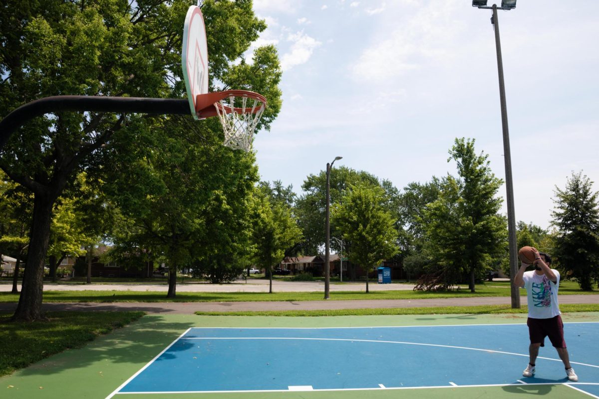 Longtime Chicago resident German Fonseca gets ready to attempt a layup on the court at Bogan Park in the Ashburn neighborhood on Friday, July 10, 2026. This photo is part of the Columbia Chronicle’s “77 Community Areas” project, documenting Chicago in celebration of America’s 250th birthday.