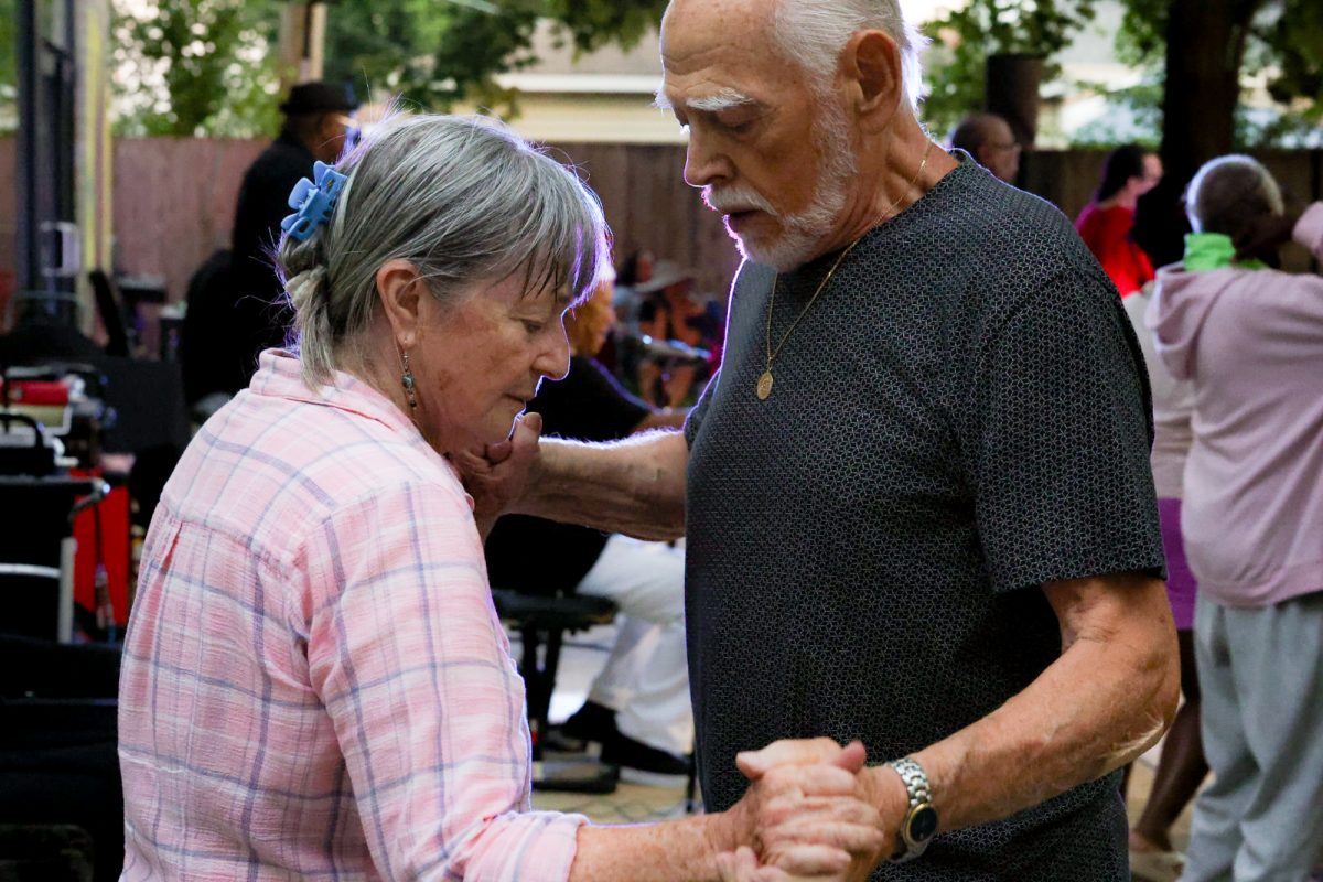 A couple dances during the Music Mondays event at the Beverly Arts Center located in Morgan Park on Monday, July 13, 2026. Music Mondays takes place weekly and is a longtime tradition for the Morgan Park neighborhood. This photo is part of the Columbia Chronicle’s “77 Community Areas” project, documenting Chicago in celebration of America’s 250th birthday.