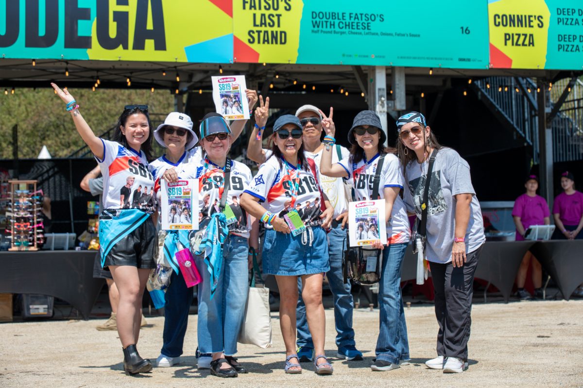 Excited supporters of the Pinoy pop group SB19 wear shirts with large letters spelling the band's name at Grant Park, Chicago, on Thursday, July 30, 2026. According to the group, many of the supporters are from all over the world, including London, Las Vegas, Washington and Chicago.