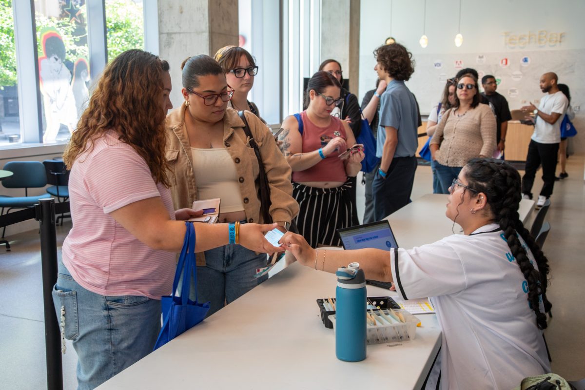 Incoming students line up to receive their Columbia ID cards on the first floor of the Student Center during orientation on Monday, July 13, 2026.