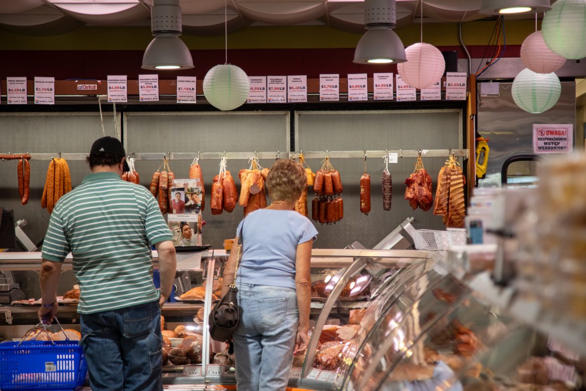 Customers look at the availability of meats at Andy's Deli in Jefferson Park, established in 1918 in Chicago on Friday, July 25, 2026. This photo is part of the Columbia Chronicle’s “77 Community Areas” project, documenting Chicago in celebration of America’s 250th birthday.