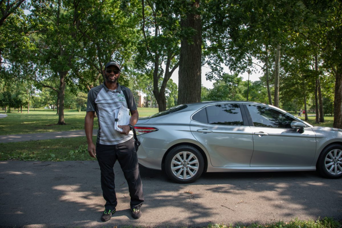 Antwon Edwards, vice president of the North Lawndale Eagles, stands with a clipboard in hand in the Douglass Park neighborhood on Tuesday, July 28, 2026. Edwards is now in his 30th year on the team. This photo is part of the Columbia Chronicle’s “77 Community Areas” project, documenting Chicago in celebration of America’s 250th birthday.