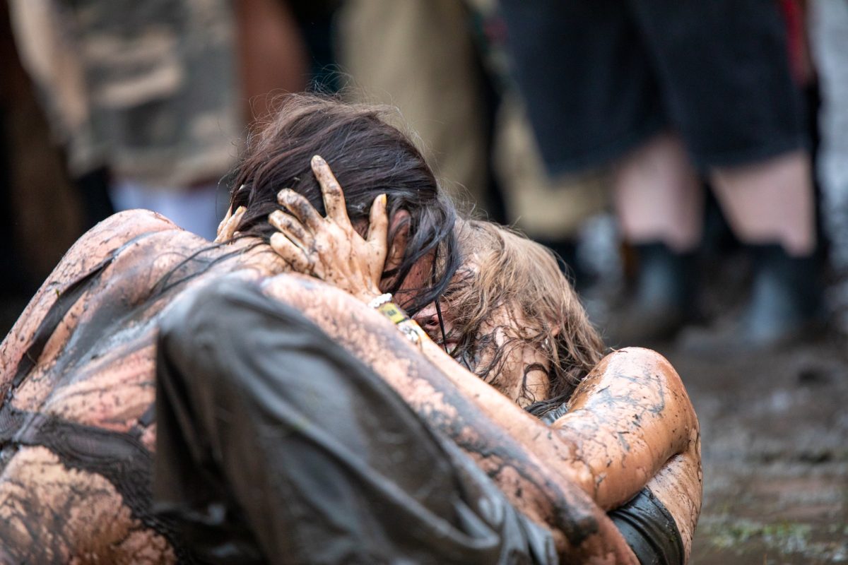 A spontaneous lesbian mud wrestling event spawns in the middle of Grant Park amidst the inclement weather at Lollapalooza on Saturday, Aug. 1, 2026.