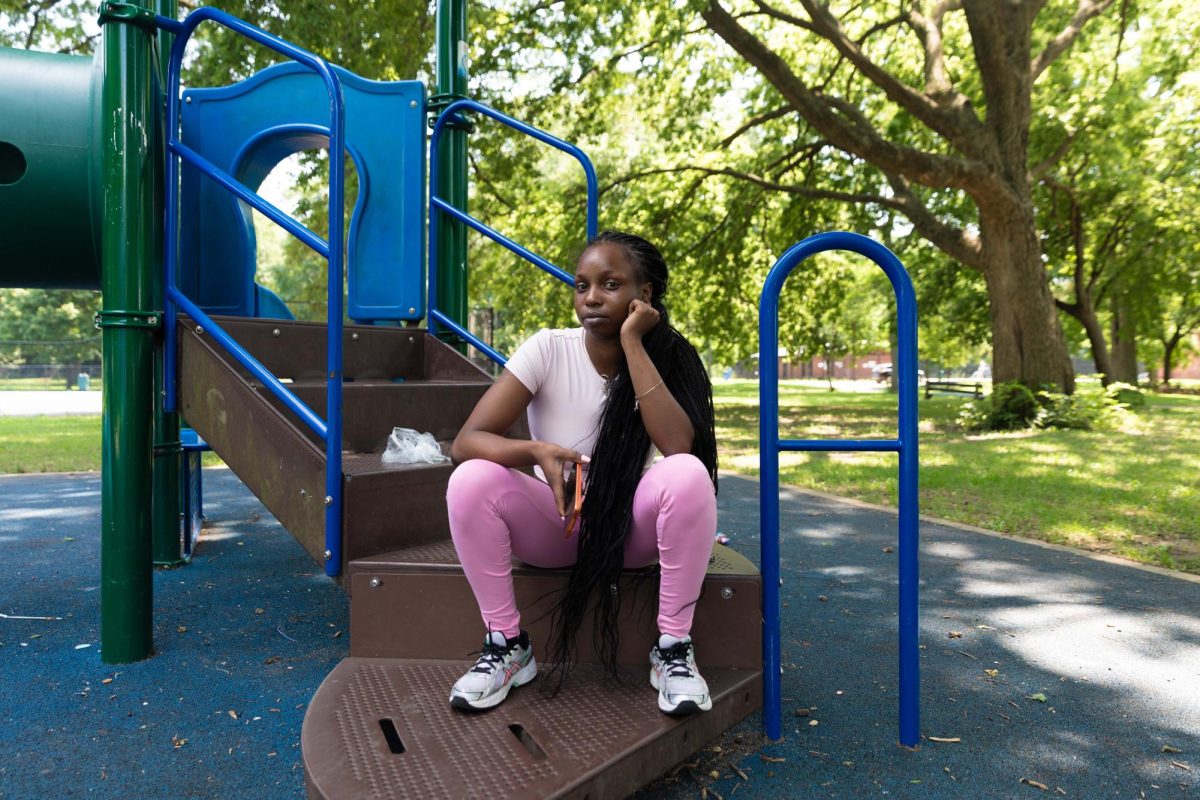 Ra Johnson rests on a playground structure at Hamilton Park in the Englewood neighborhood on Friday, Aug. 7, 2026. This photo is part of the Columbia Chronicle’s “77 Community Areas” project, documenting Chicago in celebration of America’s 250th birthday.