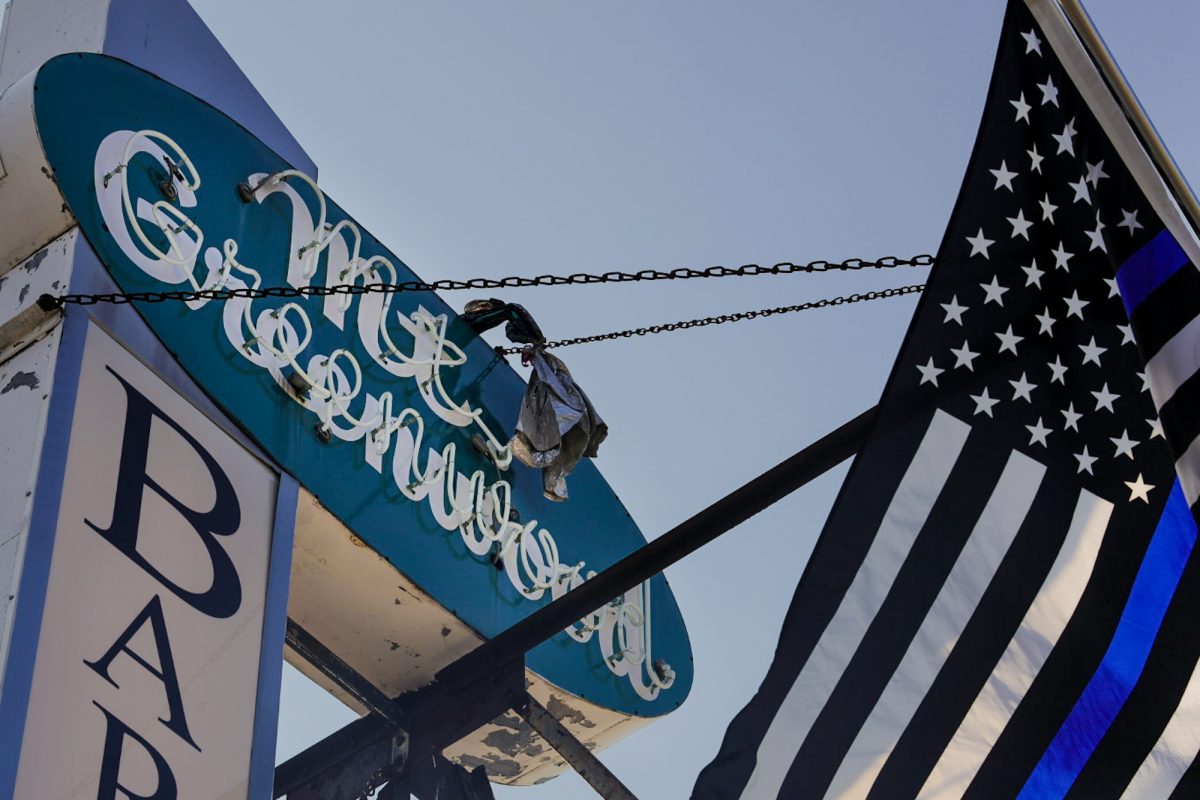 An old school style neon sign reading "Mt. Greenwood" hangs in the Mount Greenwood neighborhood on the Far Southeast Side of Chicago on Monday, Aug. 3, 2026. This photo is part of the Columbia Chronicle’s “77 Community Areas” project, documenting Chicago in celebration of America’s 250th birthday.