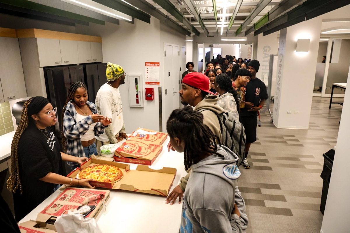 Students line up for pizza during the Black Student Union "Welcome Back Cookout!" event on Wednesday, Sept. 16, 2026.