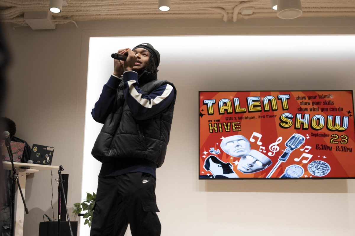 Sophomore music business major Keith "Kash" Smith sings at the Black Student Union Talent Show at the Hive in the 618 S. Michigan Ave. building on Wednesday, Sept. 23, 2026.