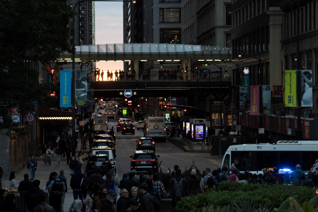 Crowds gather near Millennium Park and East Madison Street to watch the Chicagohenge sunset on Tuesday, Sept. 22, 2026.