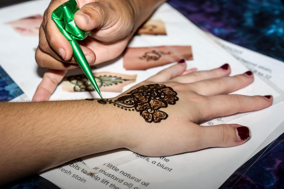 A student receives Henna design during Convocation at Columbia's Student Center on Friday, Sept. 4, 2026.