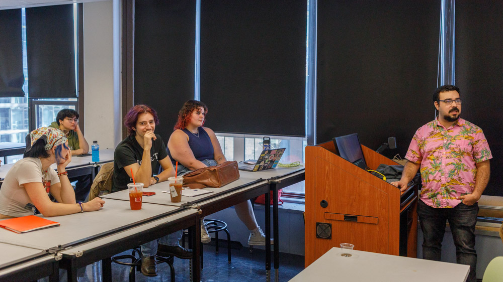 Maximo Grano De Oro, assistant professor in the School of Theatre and Dance, goes over an image presented in class on the 6th floor of the 623 S. Wabash Ave. building on Monday, Sept. 28, 2026.