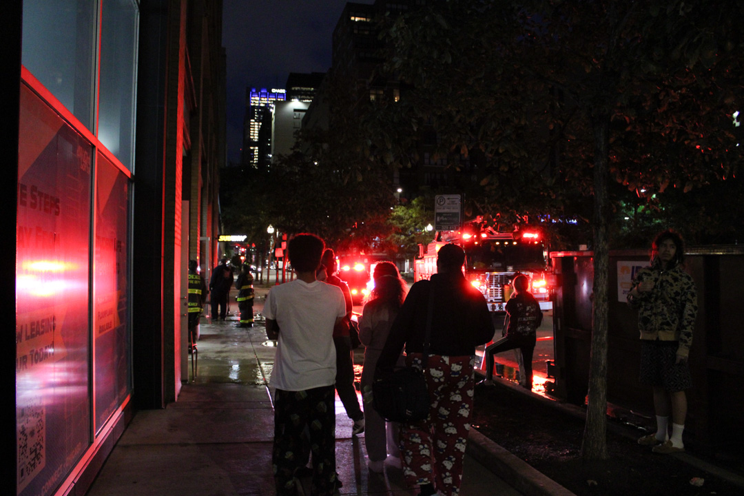 Students gather outside the Dwight Lofts after evacuating as firefighters respond to a fire at 642 S. Clark St. on Tuesday morning, Sept. 22, 2026.