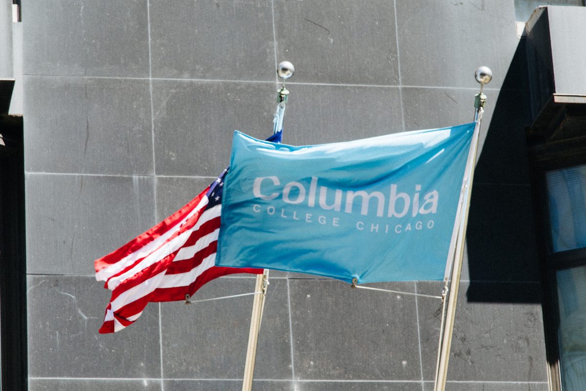 An American flag, along with a Columbia College Chicago flag, flutters above 623 S. Wabash Ave. on Monday, May 4, 2026.