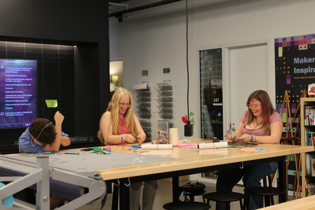 Abby Rodriguez, first-year journalism and communication major, laughs with Lilly Gentry, first-year creative writing major, and Brianna King, first-year sound design for media and stage major, while working on crafts in the Makerspace and the Student Center on Tuesday, Sept. 8, 2026.