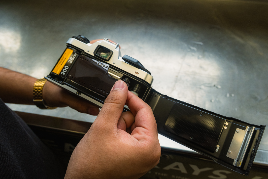 A student loads color film into a 35mm camera at the photography darkrooms on the 10th floor of the 600 S. Michigan Ave. building on Thursday, Oct. 1, 2026.