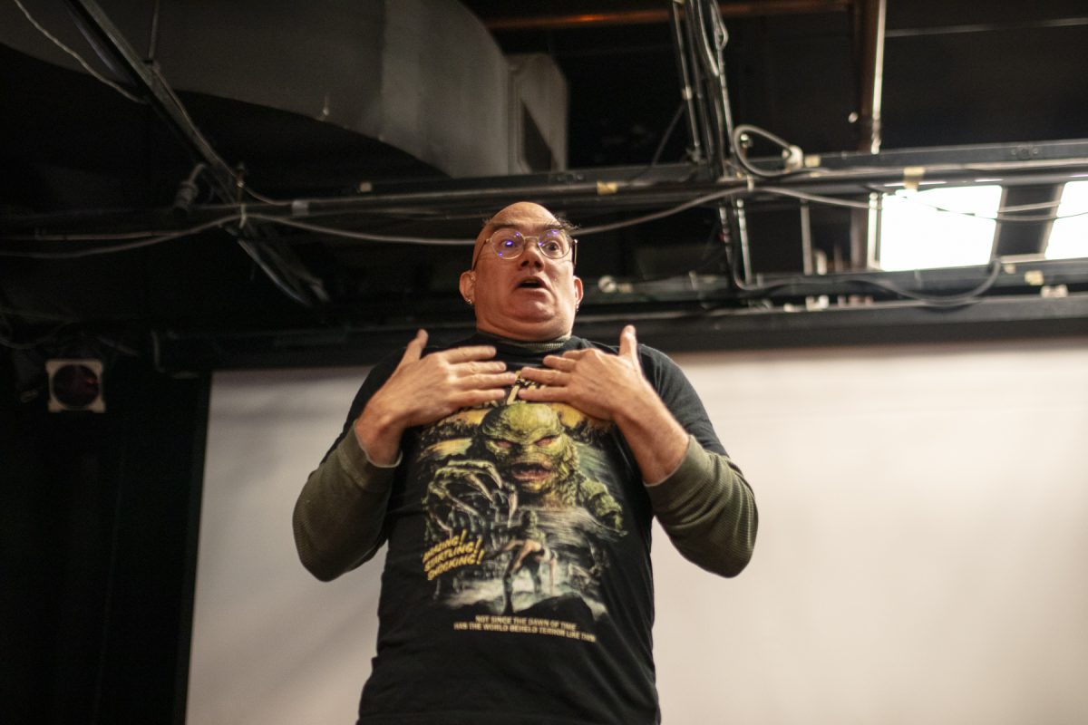 Crom Saunders, a professor in the School of Communication and Culture, tells ghost stories for ASL Ghost Storytelling at the Haus on the first floor of 623 S. Wabash Ave. on Monday, Oct. 26, 2026.