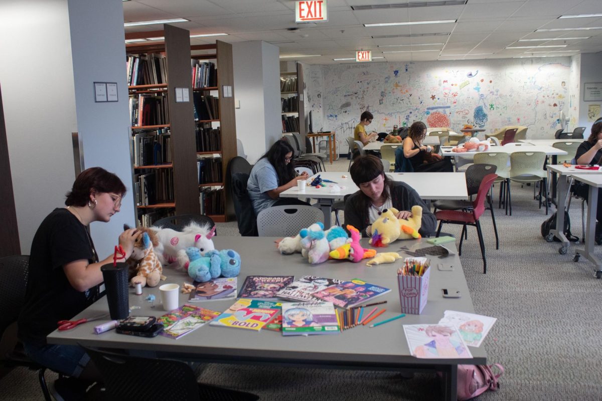 Students customize stuffed animals at the FrankenToys event on the fourth floor of the library on Tuesday, Oct. 27, 2026.