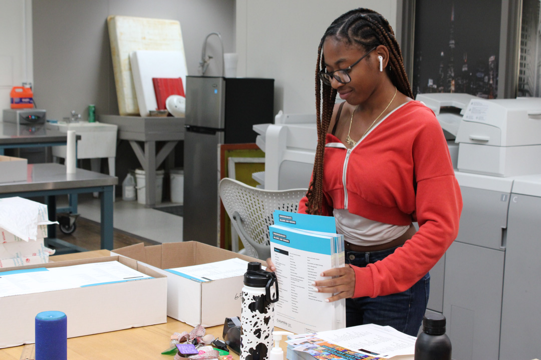 Junior graphic design major ShyBria Starkley prepares flyers at the Digital Print Center at 623 S. Wabash Ave. on Thursday, Sept. 17, 2026.