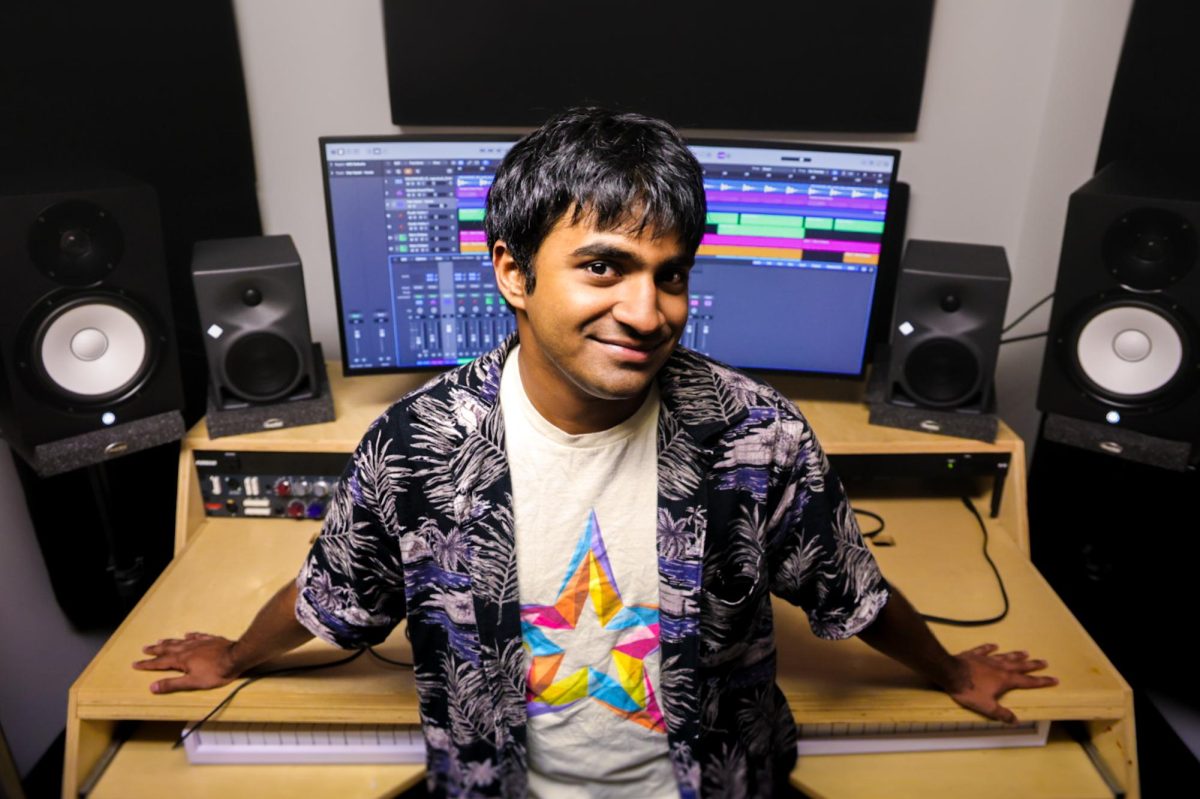 Sitting in the studio where hours of his most recent album were created, Vian Haziel, a senior music major, poses for a portrait following the release of his newest studio album, “Flawless,” on Friday, Oct. 9, 2026.