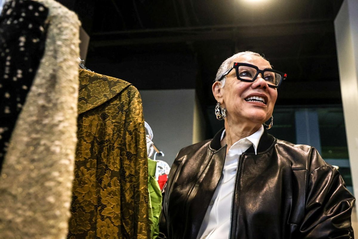 Chicago-based fashion designer Barbara Bates sees a clothing rack displaying vintage pieces she has designed throughout her career, during a Lunch and Learn event hosted by the School of Fashion on Thursday, Oct. 15, 2026. The pieces, specially curated by faculty member Jenny Leigh Du Puis, are planned to become accessible learning resources for all Columbia fashion students.