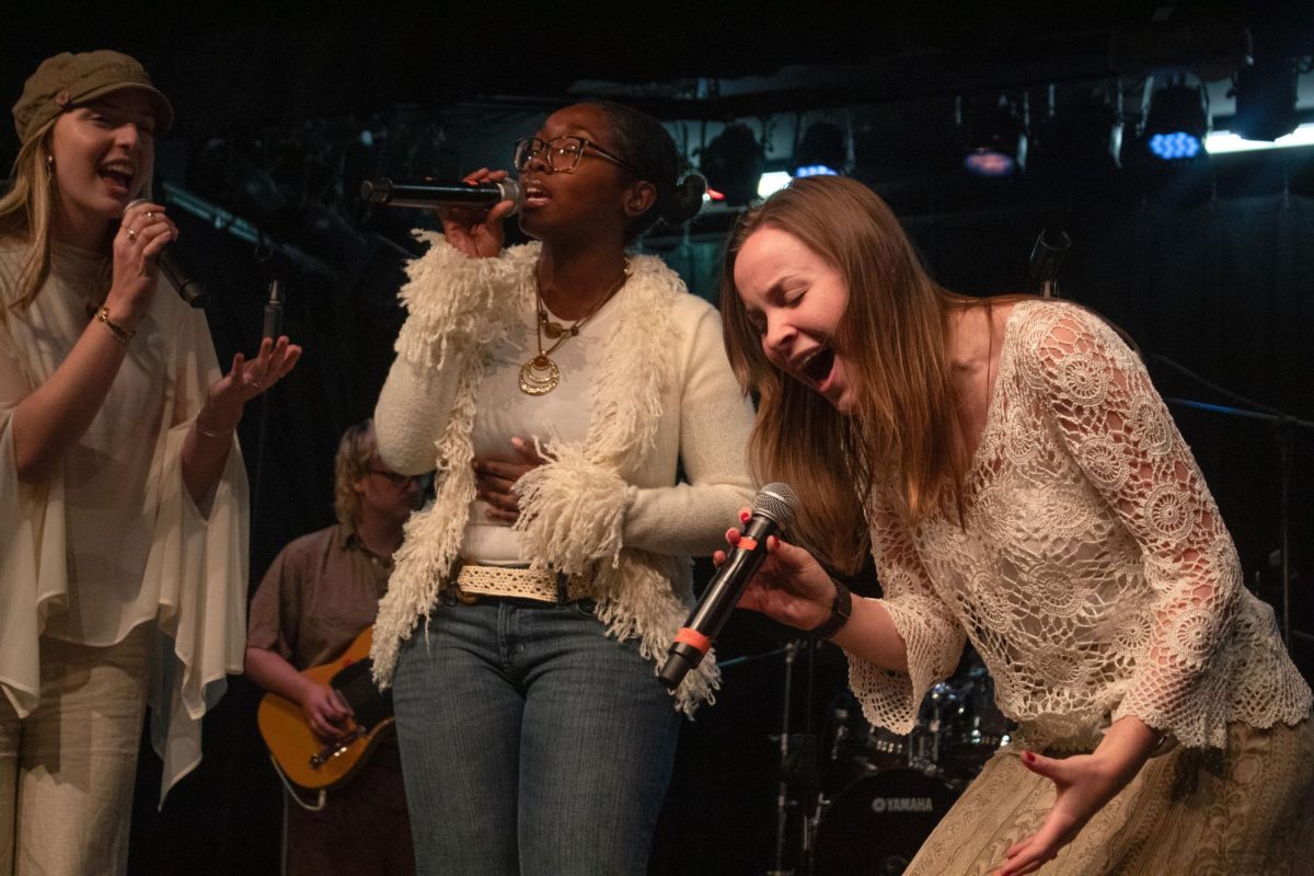 Amy Fisher, a senior music major, Destini Jones, a junior music major and Kamila Kay, a junior music major, practice singing "The Cure" by Olivia Rodrigo for their midterm performance in the "Pop/Rock Ensemble" class showcase on Tuesday, Oct. 27, 2026.